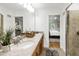 Bright main bathroom featuring double sinks, a walk-in shower and stylish fixtures at 4902 Brookhaven Dr, Raleigh, NC 27612