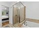 Main bathroom features a large walk-in shower and luxurious soaking tub at 4902 Brookhaven Dr, Raleigh, NC 27612
