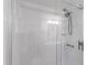 Modern tiled shower with glass doors and sleek fixtures, creating a luxurious bathing experience at 4902 Brookhaven Dr, Raleigh, NC 27612