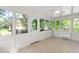 Bright sunroom features tile flooring and an abundance of windows that allow for ample natural light at 4902 Brookhaven Dr, Raleigh, NC 27612