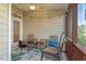 Cozy screened porch with seating area, creating a relaxing space for enjoying the outdoors at 4924 Amber Clay Ln, Raleigh, NC 27612
