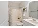 Bathroom featuring shower/tub combo, white cabinets, and grey walls at 4924 Amber Clay Ln, Raleigh, NC 27612