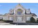 Beautiful clubhouse with stone accents, white trim and doors, and ample parking spaces in front at 4924 Amber Clay Ln, Raleigh, NC 27612