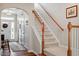 Welcoming foyer with a staircase and hardwood floors at 4924 Amber Clay Ln, Raleigh, NC 27612