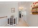 Upstairs hallway featuring white trim and neutral walls that leads to other bedrooms at 4924 Amber Clay Ln, Raleigh, NC 27612