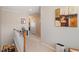 Upstairs hallway with neutral walls, carpet and stairway to the first floor at 4924 Amber Clay Ln, Raleigh, NC 27612