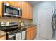 Modern kitchen featuring updated appliances and cabinetry at 4924 Amber Clay Ln, Raleigh, NC 27612
