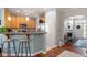 Open kitchen with breakfast bar and stainless steel appliances at 4924 Amber Clay Ln, Raleigh, NC 27612