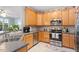 Well-equipped kitchen with ample cabinetry and stainless steel appliances at 4924 Amber Clay Ln, Raleigh, NC 27612