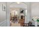 Open-concept living and dining area featuring hardwood floors and abundant natural light at 4924 Amber Clay Ln, Raleigh, NC 27612