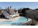 Aerial view of community pool and clubhouse with views of surrounding homes at 4924 Amber Clay Ln, Raleigh, NC 27612