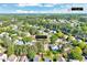 An aerial view showcases the house's location near downtown Durham, surrounded by lush greenery in a residential neighborhood at 5016 Silhouette Dr, Durham, NC 27713