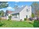 Lovely backyard features a well-maintained lawn and vinyl siding at 5016 Silhouette Dr, Durham, NC 27713