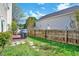 Well-maintained backyard featuring a privacy fence, grill and lush grass at 5016 Silhouette Dr, Durham, NC 27713