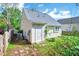 Charming backyard features a cozy patio area and lush green surroundings at 5016 Silhouette Dr, Durham, NC 27713
