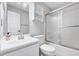 Bathroom with a white vanity, toilet, and a shower with sliding glass doors at 5016 Silhouette Dr, Durham, NC 27713