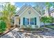 Charming single-story home featuring green shutters, a well-maintained yard, and a welcoming entryway at 5016 Silhouette Dr, Durham, NC 27713