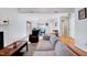 Open-concept living area with hardwood floors, fireplace, and a view of the adjacent dining area at 5016 Silhouette Dr, Durham, NC 27713