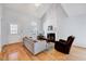 Inviting living area boasts hardwood floors, a stylish fireplace, and lots of natural light at 5016 Silhouette Dr, Durham, NC 27713