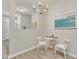 Charming dining space featuring a round table, two chairs, and a chandelier at 5110 Neuse Commons Ln # 109, Raleigh, NC 27616