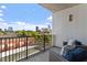 Charming balcony with cushioned chairs offering stunning views of the city skyline at 523 S West St # 404, Raleigh, NC 27601