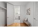 Modern bathroom features an open doorway, ceramic tile, a toilet, and shower-tub combination at 523 S West St # 404, Raleigh, NC 27601