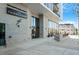 Building entrance with modern architecture, well-maintained landscaping, and brick facade at 523 S West St # 404, Raleigh, NC 27601