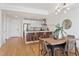 Open concept kitchen and dining area with wood floors and modern lighting at 523 S West St # 404, Raleigh, NC 27601
