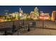 Charming rooftop seating offering a breathtaking night view of the city skyline, perfect for urban enjoyment at 523 S West St # 404, Raleigh, NC 27601