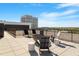 Relaxing roof deck with comfortable seating, offering stunning views of the cityscape and clear blue sky at 523 S West St # 404, Raleigh, NC 27601