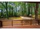Enjoy the view of this large backyard with mature trees from the back deck at 5312 Woodsdale Rd, Raleigh, NC 27606