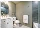 Stylish bathroom with tiled shower, vanity and modern fixtures at 5312 Woodsdale Rd, Raleigh, NC 27606