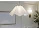 Modern dining room with designer light fixture and bright lighting at 5312 Woodsdale Rd, Raleigh, NC 27606