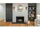 This living room fireplace boasts a decorative mantle and built-in shelving at 5312 Woodsdale Rd, Raleigh, NC 27606