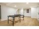 Basement game room featuring a ping pong table and ample space for entertainment at 5312 Woodsdale Rd, Raleigh, NC 27606
