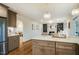 Open kitchen with large island connecting to the living room, great for entertaining at 5312 Woodsdale Rd, Raleigh, NC 27606