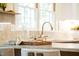 Bright kitchen area with granite countertops and a view of the outside from above the sink at 5312 Woodsdale Rd, Raleigh, NC 27606