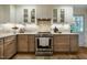 Modern kitchen featuring stainless steel appliances, light colored counters and traditional style cabinets at 5312 Woodsdale Rd, Raleigh, NC 27606