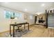 Inviting living space with a brick fireplace, light wood flooring, and a dedicated office space at 5312 Woodsdale Rd, Raleigh, NC 27606