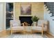 Comfortable living space featuring a fireplace, stairs, and luxury finishes at 5312 Woodsdale Rd, Raleigh, NC 27606