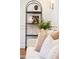 Elegant living room with decorative shelving, plush pillows and stylish decor at 5312 Woodsdale Rd, Raleigh, NC 27606