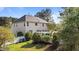 Two-story house with a well-maintained backyard, pergola and beautiful landscaping at 5408 Colonial Oaks Dr, Apex, NC 27539