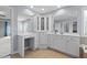Bright bathroom with double sinks, large mirrors, lots of storage, and access to an adjoining shower/bath at 5408 Colonial Oaks Dr, Apex, NC 27539