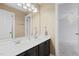 A bathroom with a double sink vanity and a large mirror, exuding a relaxing atmosphere at 5408 Colonial Oaks Dr, Apex, NC 27539