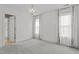A bright bedroom with neutral walls, carpet, and plenty of natural light from the windows at 5408 Colonial Oaks Dr, Apex, NC 27539