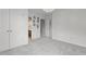 A bedroom with neutral walls, carpet, and a door leading to the bathroom, creating a relaxing space at 5408 Colonial Oaks Dr, Apex, NC 27539