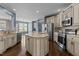 Modern kitchen with stainless appliances, granite countertops, an island, and lots of cabinet space at 5408 Colonial Oaks Dr, Apex, NC 27539