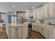 Spacious kitchen with stainless appliances, granite countertops, and ample storage space at 5408 Colonial Oaks Dr, Apex, NC 27539
