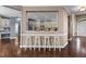 Stylish kitchen features a bar with seating and an open view into the adjacent eat-in kitchen at 5408 Colonial Oaks Dr, Apex, NC 27539