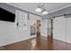 Bright living room with white trim and a sliding barn door, creating an open and airy ambiance at 5408 Colonial Oaks Dr, Apex, NC 27539